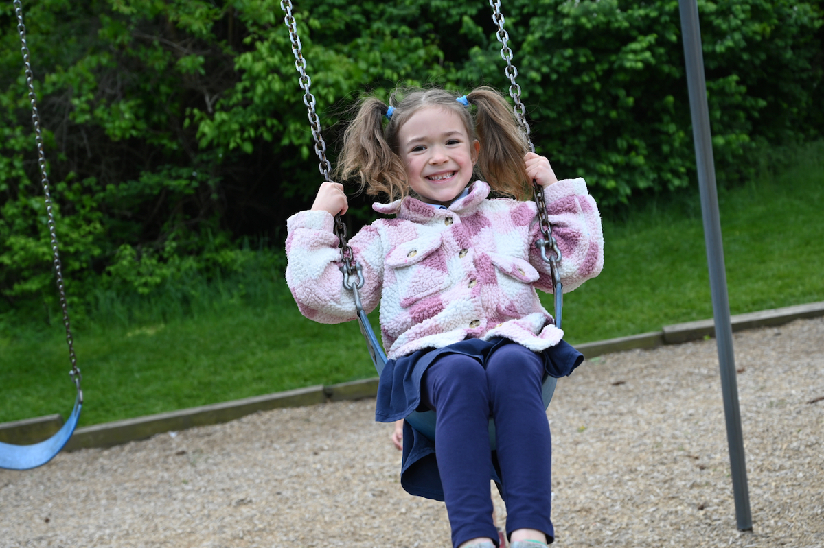 child swinging