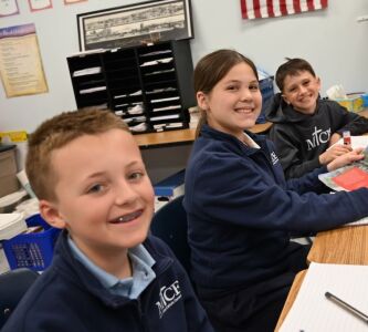 three boys smiling